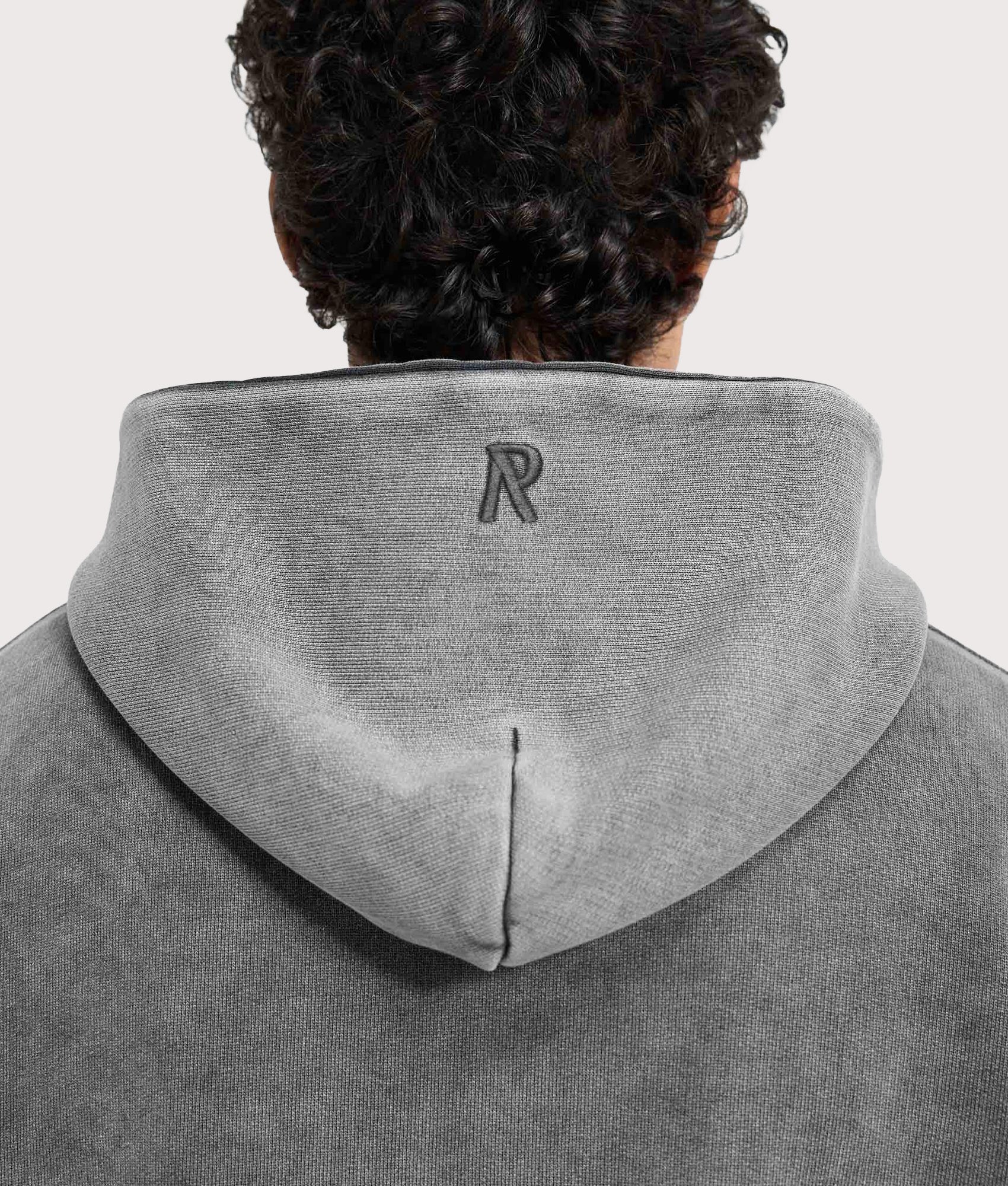 REPRESENT Initial Boxy Hoodie in Vintage Grey at EQVVS Menswear. Detail shot.