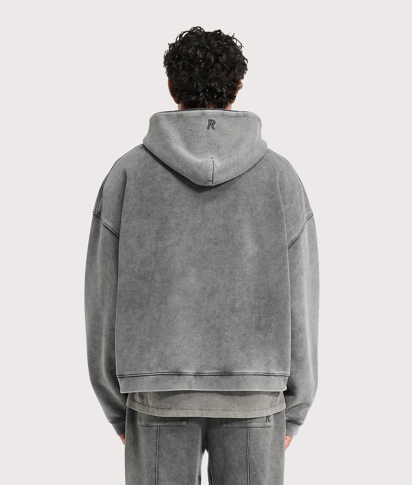 REPRESENT Initial Boxy Hoodie in Vintage Grey at EQVVS Menswear. Back shot.