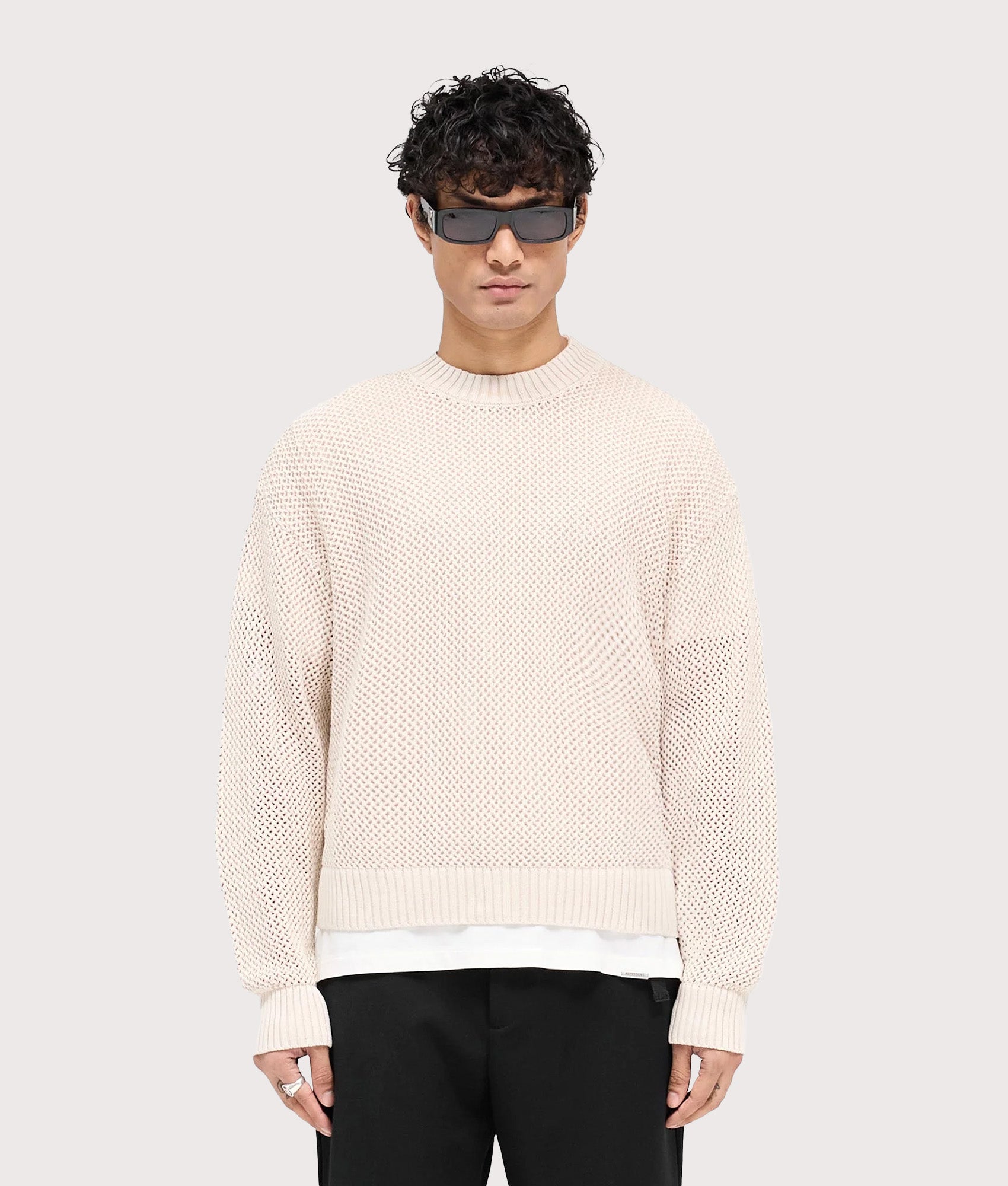 REPRESENT Oversized Fit Open Gauge Knit Jumper in Off White at EQVVS Menswear. Model front shot.