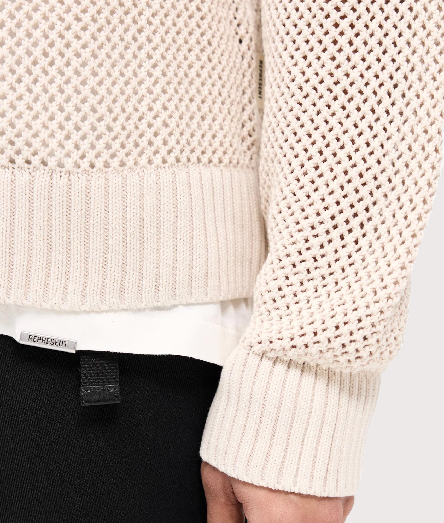 REPRESENT Oversized Fit Open Gauge Knit Jumper in Off White at EQVVS Menswear. Detail shot.