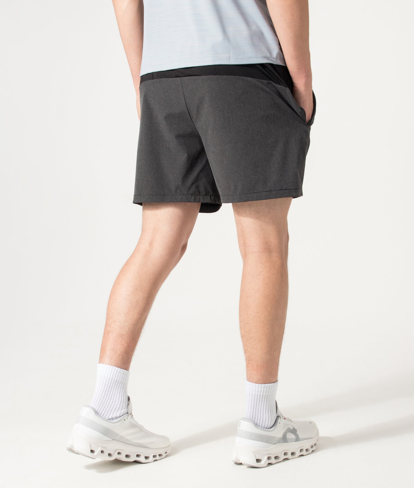 REFLECT Mesh Set Shorts in Black at EQVVS Menswear. Model back shot.