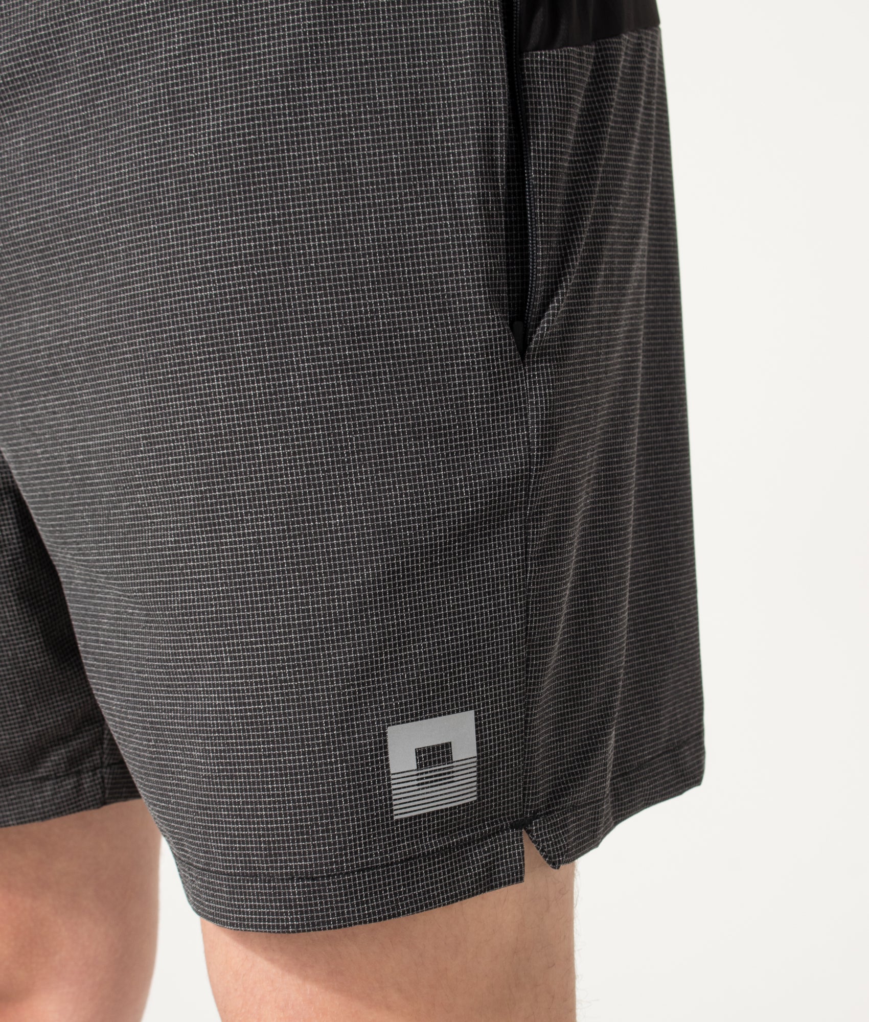 REFLECT Mesh Set Shorts in Black at EQVVS Menswear. Detail shot.