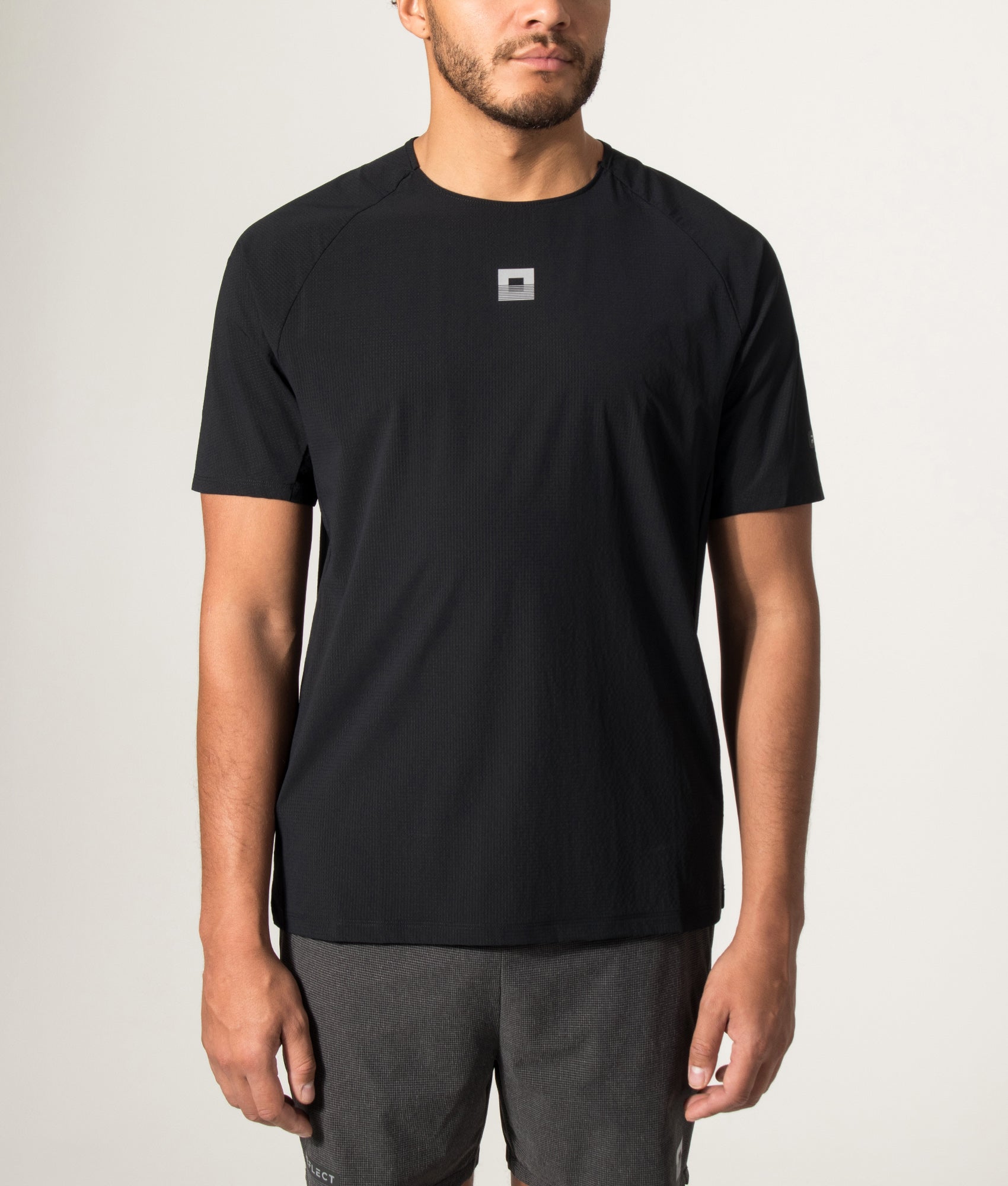 REFLECT Mesh T-Shirt in Black at EQVVS Menswear. Model front shot.