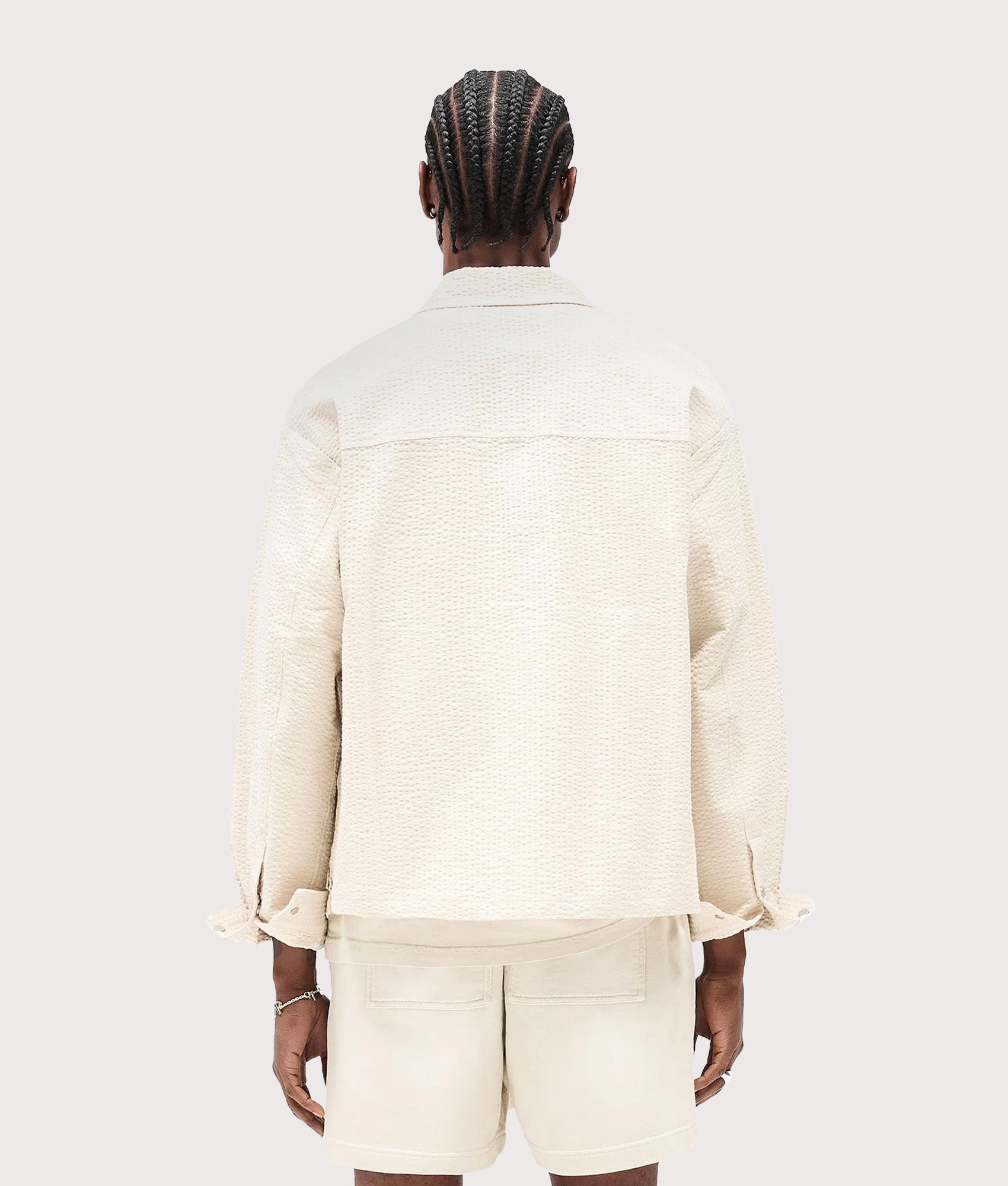 Represent Textured Long Sleeve Shirt in Champagne at EQVVS Menswear. Model back shot.