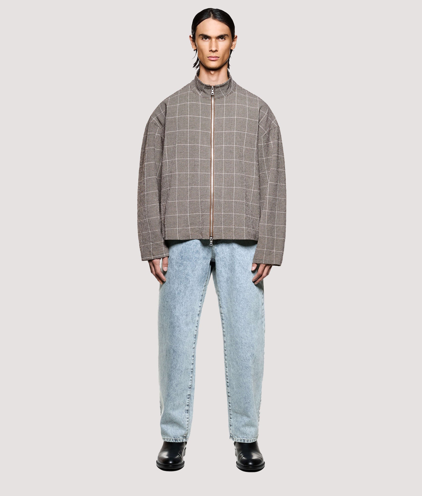 MKI MIYUKI ZOKU Box Fit Seersucker Check Track Jacket in Brown at EQVVS Menswear. Model full front shot.