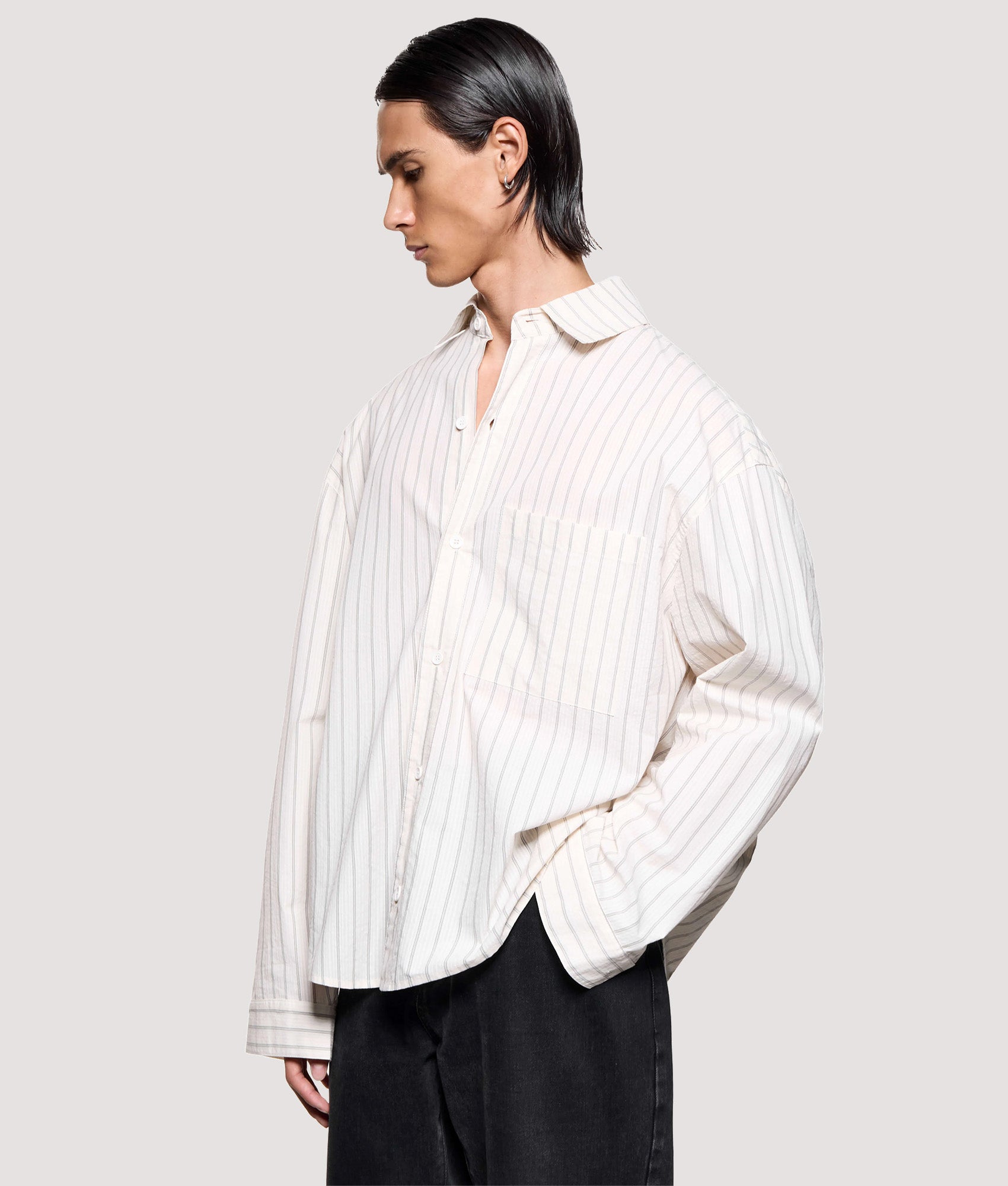 MKI MIYUKI ZOKU Box Fit Seersucker Stripe Dress Shirt in Off White at EQVVS Menswear. Angled model front shot.