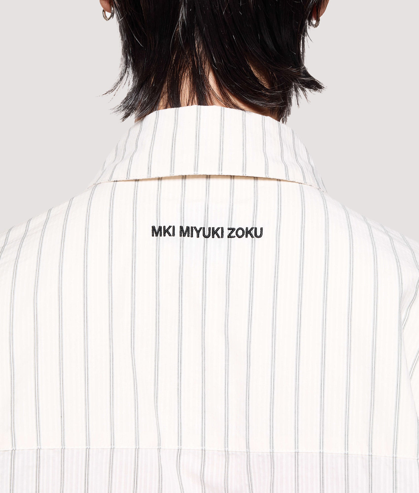 MKI MIYUKI ZOKU Box Fit Seersucker Stripe Dress Shirt in Off White at EQVVS Menswear. Back detail shot.