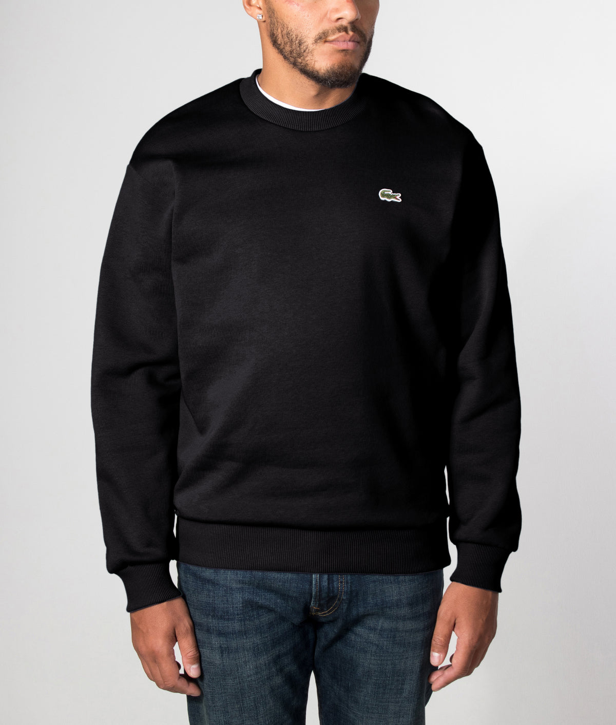 Lacoste Classic Fit Crewneck Sweatshirt in Black at EQVVS Menswear. Front model shot.