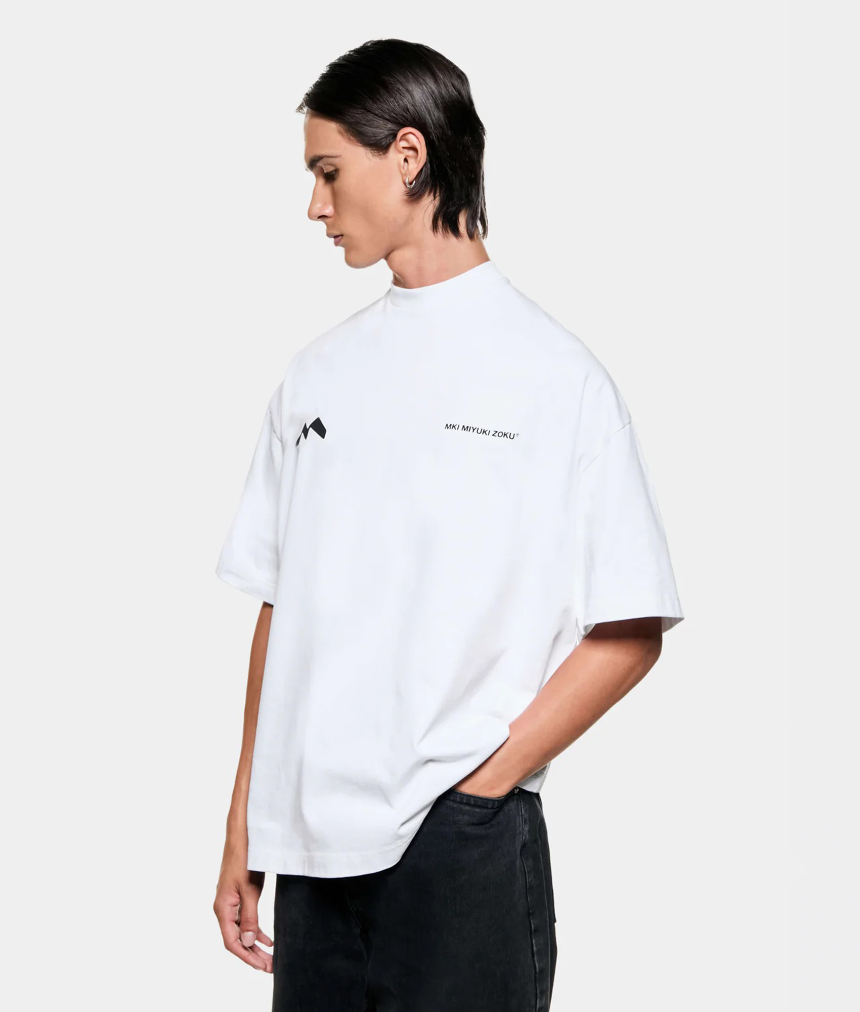 MKI MIYUKI ZOKU Silhouette T-Shirt in White at EQVVS Menswear. Angled model front shot.