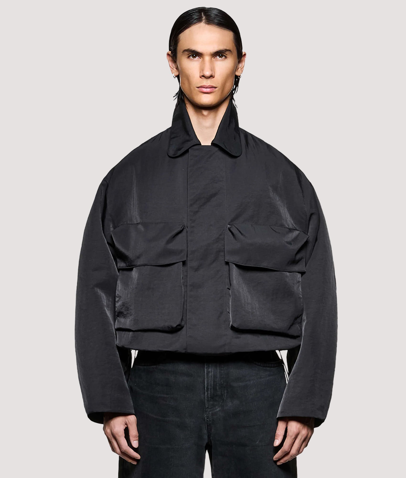 MKI MIYUKI ZOKU Box Fit Silky Nylon Pilot Jacket in Black at EQVVS Menswear. Front shot.
