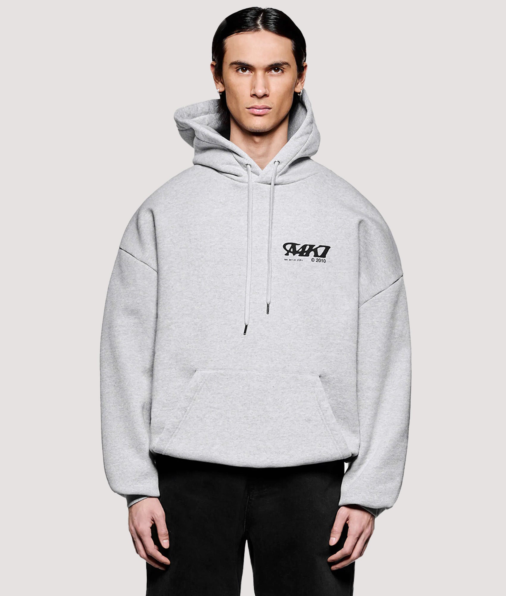 MKI MIYUKI ZOKU Box Fit Stack Hoodie in Grey at EQVVS Menswear. Model front shot.