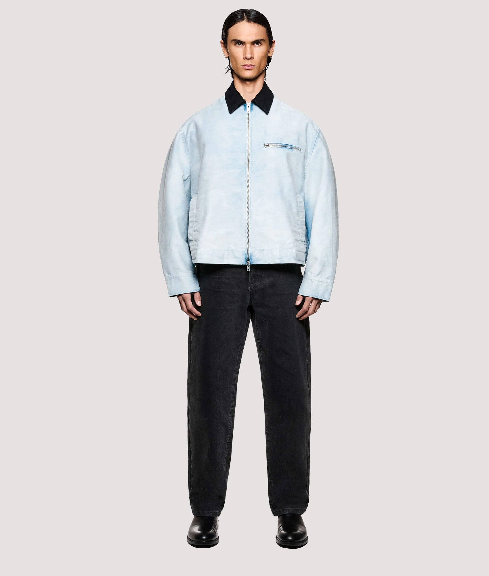 MKI MIYUKI ZOKU Box Fit Sunfaded Work Jacket in Bleach at EQVVS Menswear. Model full front shot.
