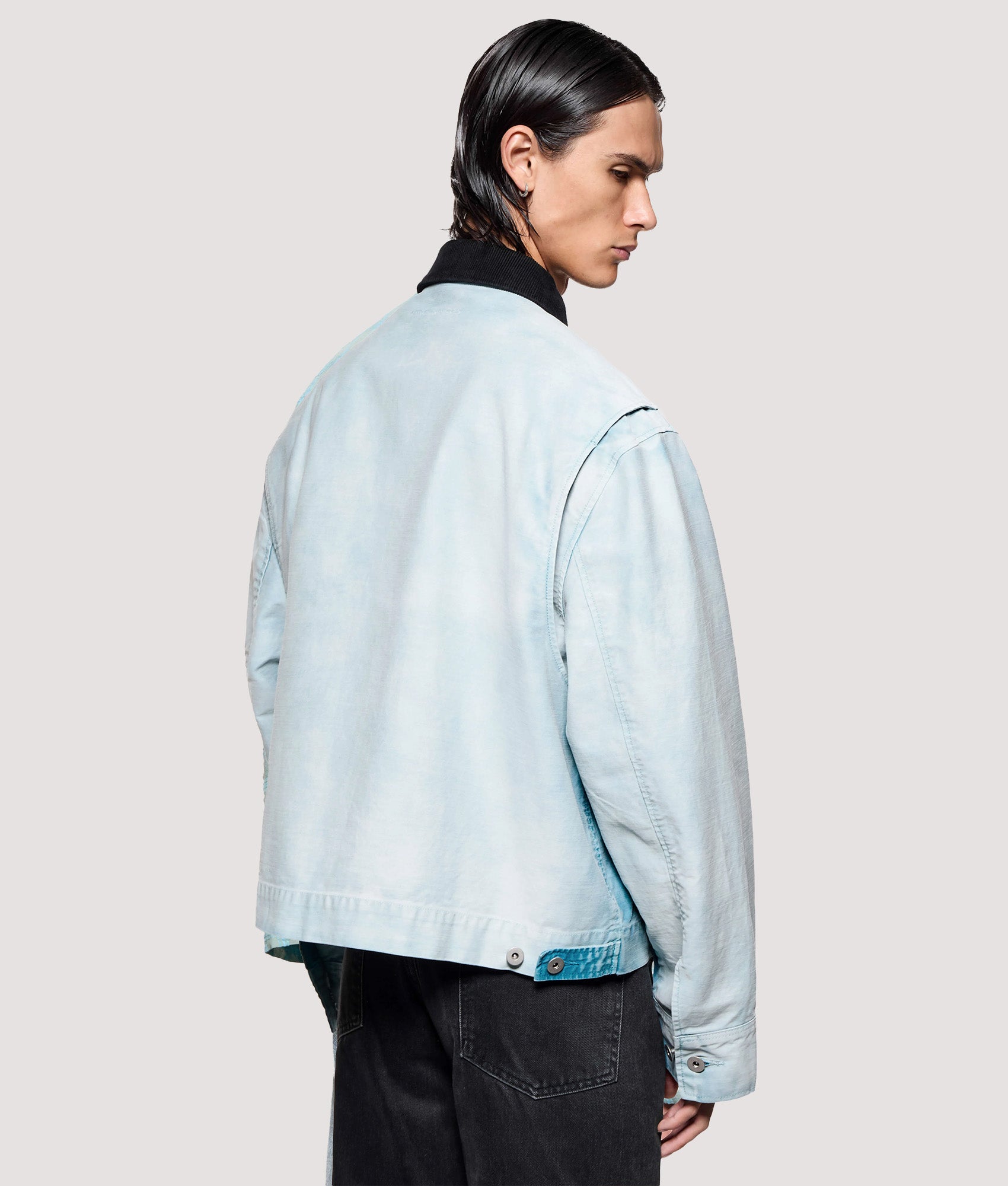 MKI MIYUKI ZOKU Box Fit Sunfaded Work Jacket in Bleach at EQVVS Menswear. Angled model back shot.