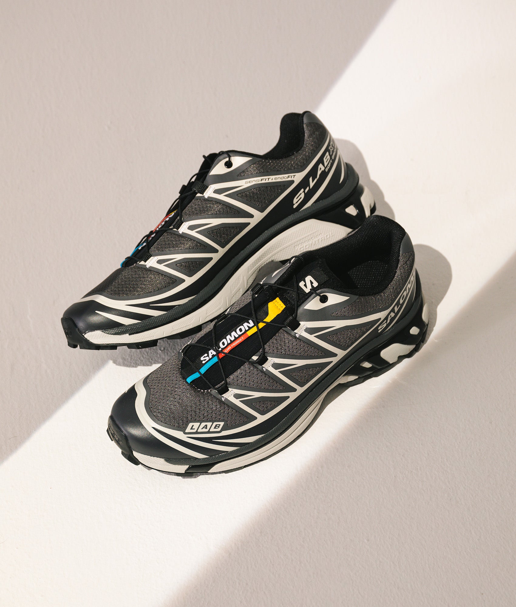 SALOMON XT-6 in Black, Asphalt and Castlerock at EQVVS Menswear. Campaign shot.