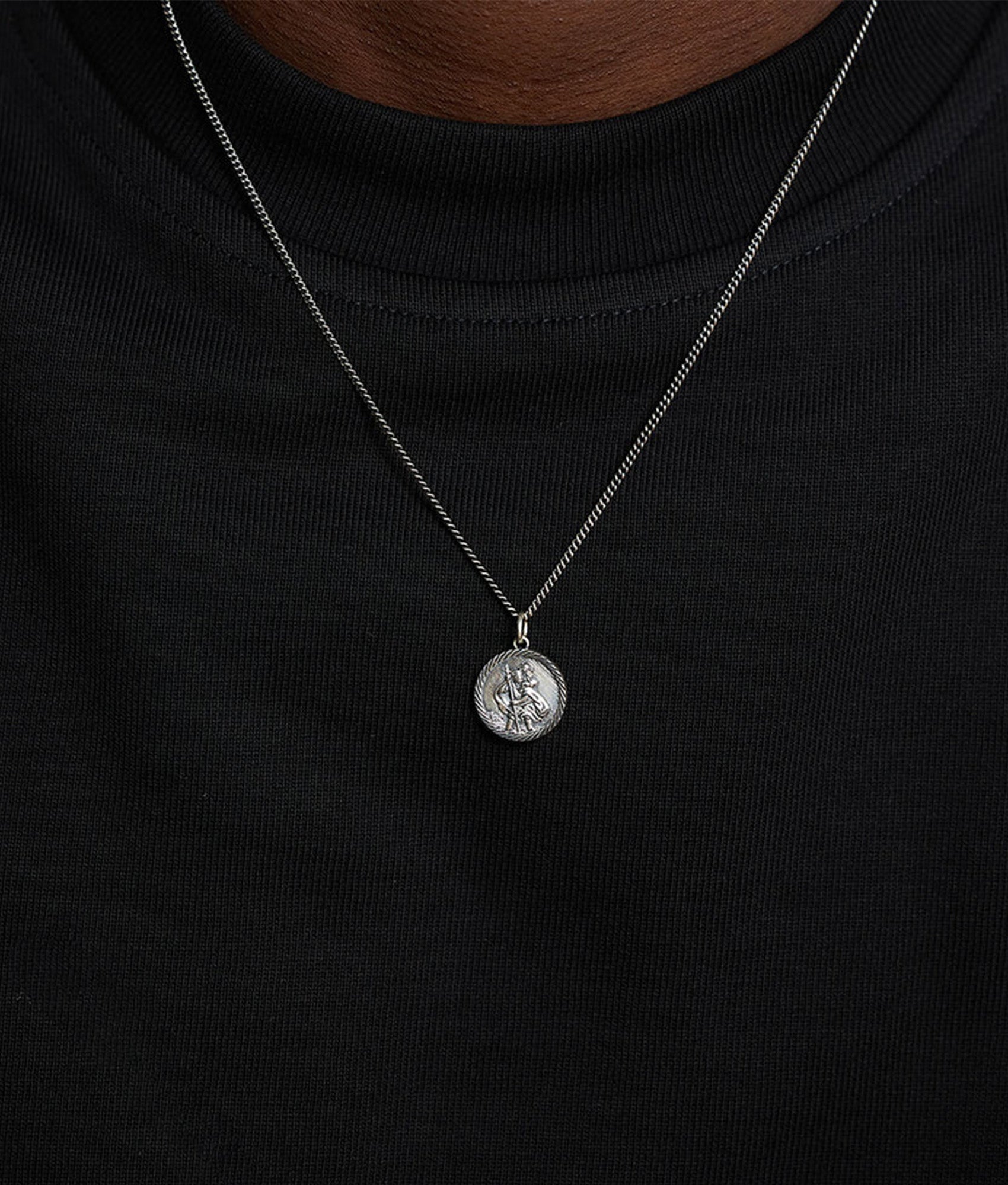 Serge DeNimes Silver St Christopher Necklace at EQVVS Menswear. Model shot.