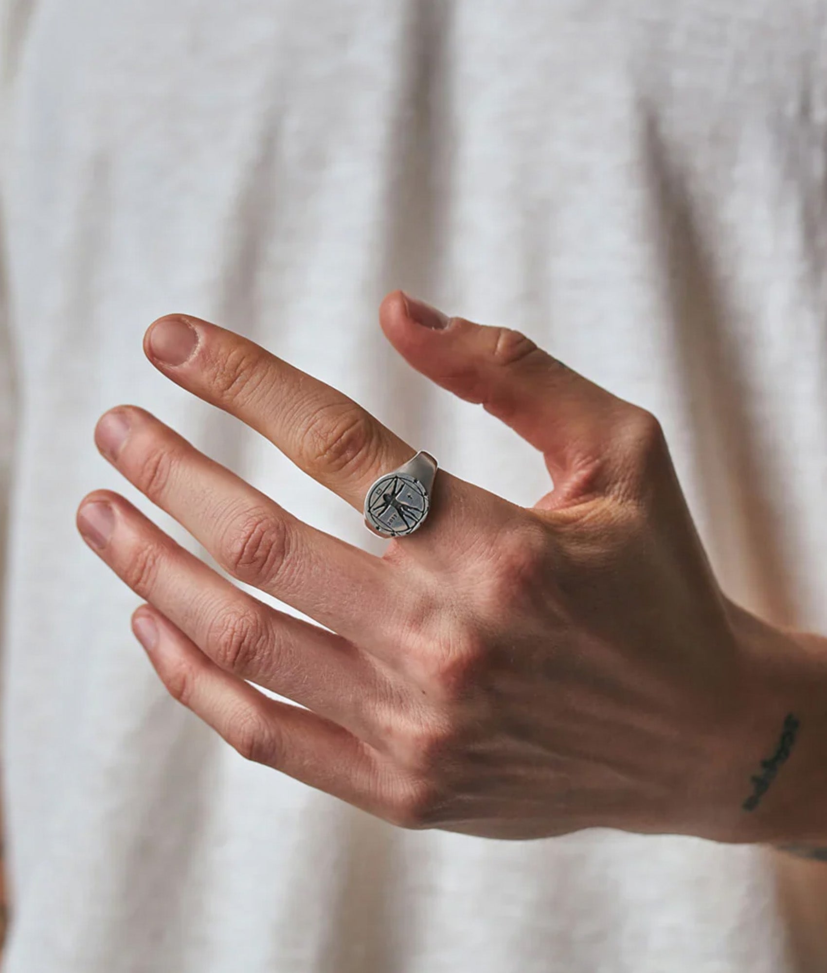 Serge Denimes Sterling Silver Vitruvian Man Ring at EQVVS Menswear. Model shot.