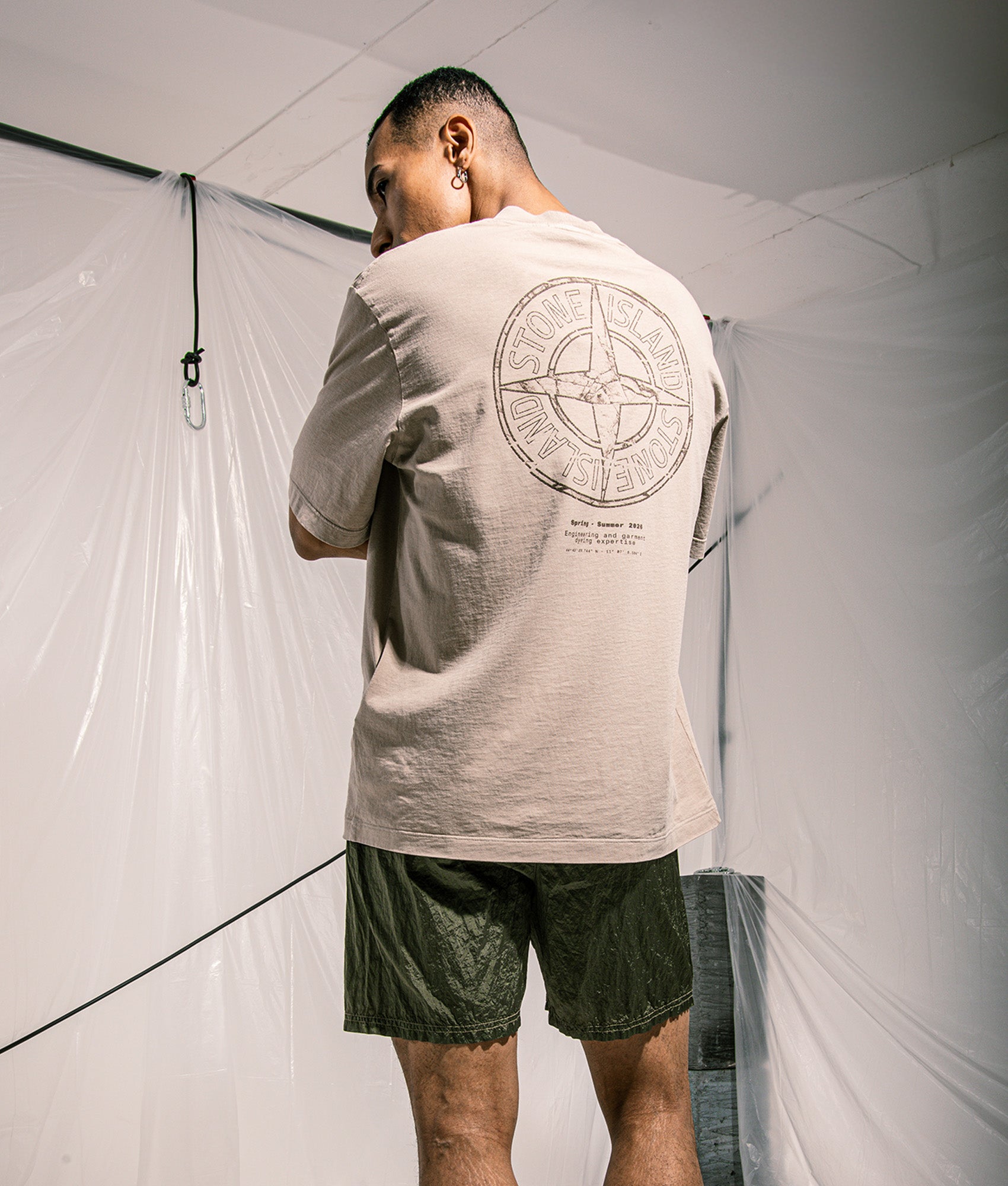 Stone Island ‘Stone’ Back Print T-Shirt in Desert Sand at EQVVS Menswear. Campaign shot.