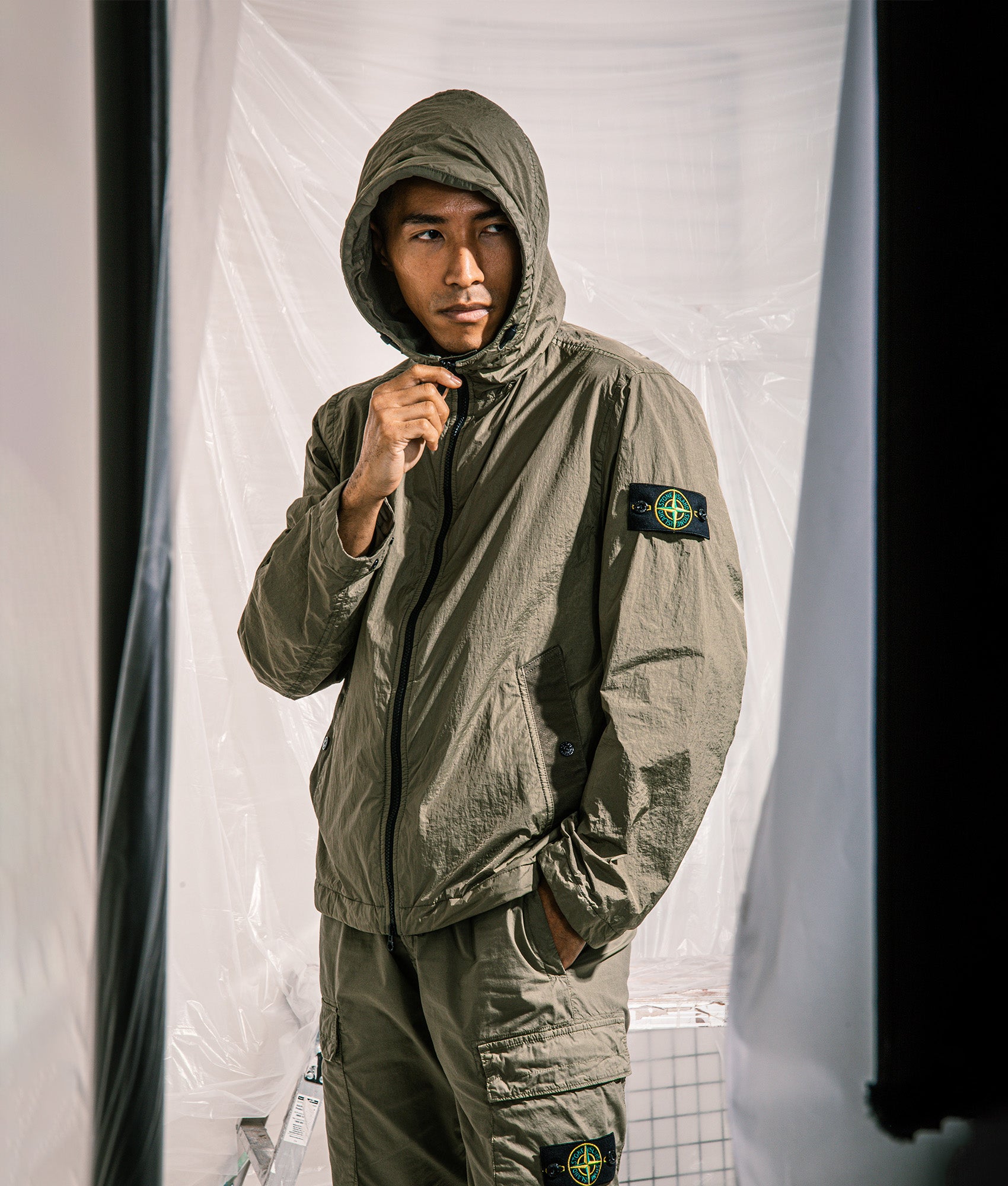 Hooded Full Zip Jacket in Military Green | Stone Island | EQVVS | Campaign shot.