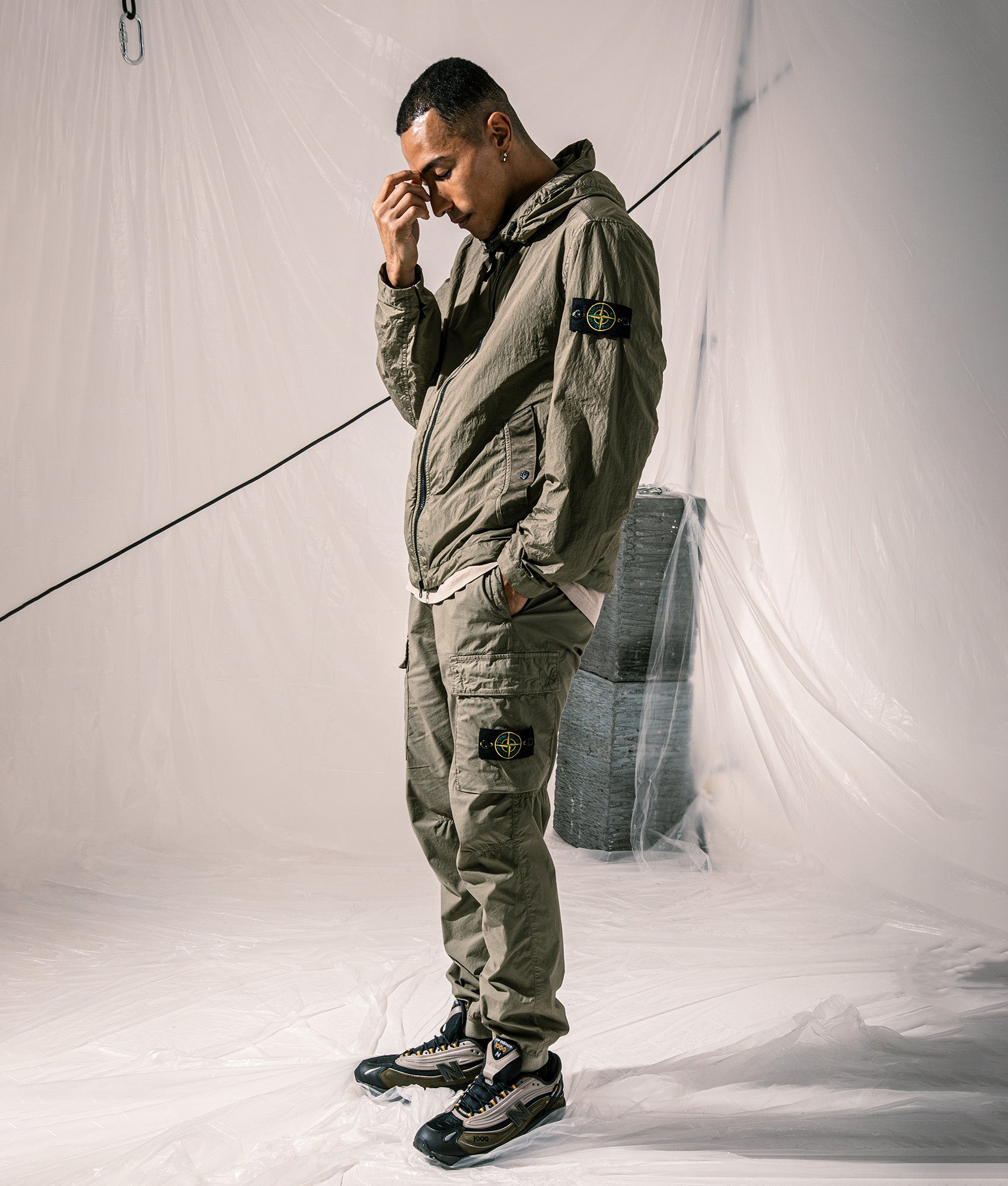 Regular Fit Tapered Cargo Pants in Military Green | Stone Island | EQVVS | Campaign shot.