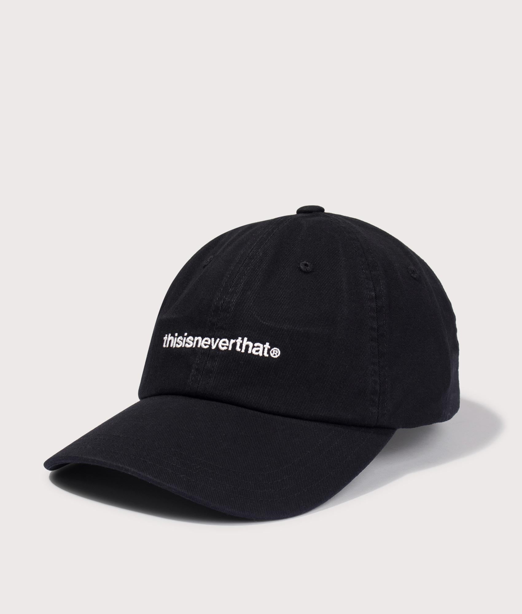 T-Logo Cap in Black by thisisneverthat. Shot by EQVVS. Front detail shot.