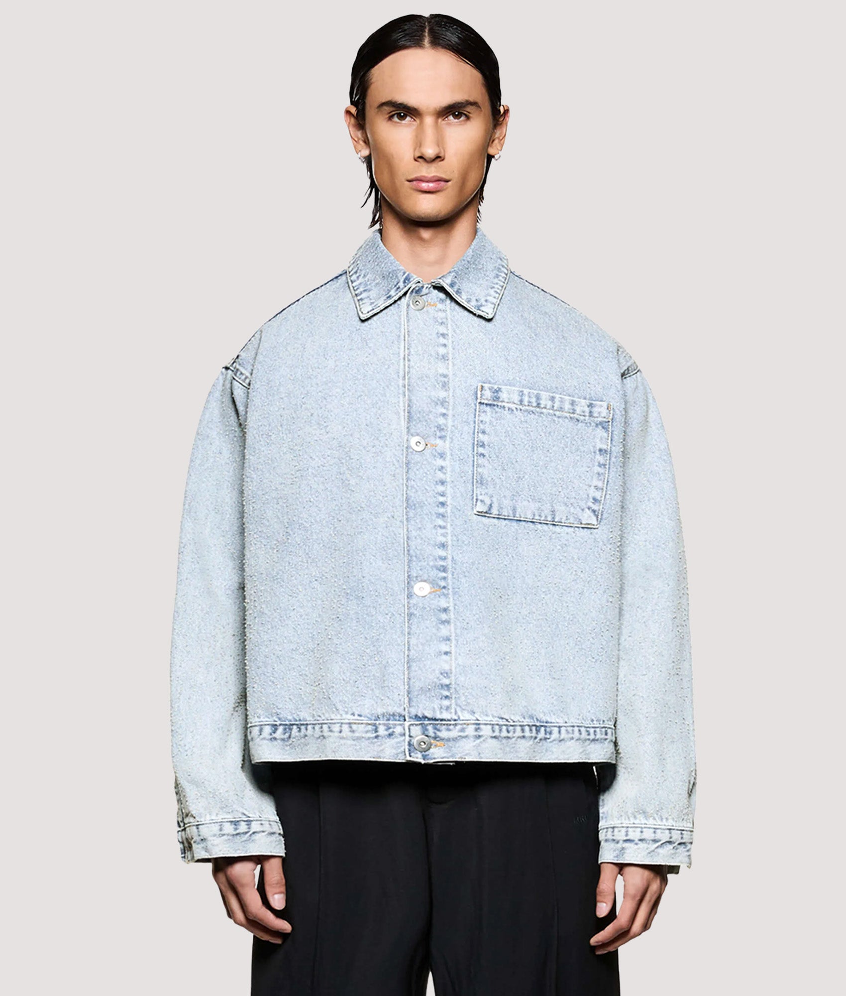 MKI MIYUKI ZOKU Box Fit Twisted Weave Trucker Jacket in Bleach Wash at EQVVS Menswear. Model front shot.