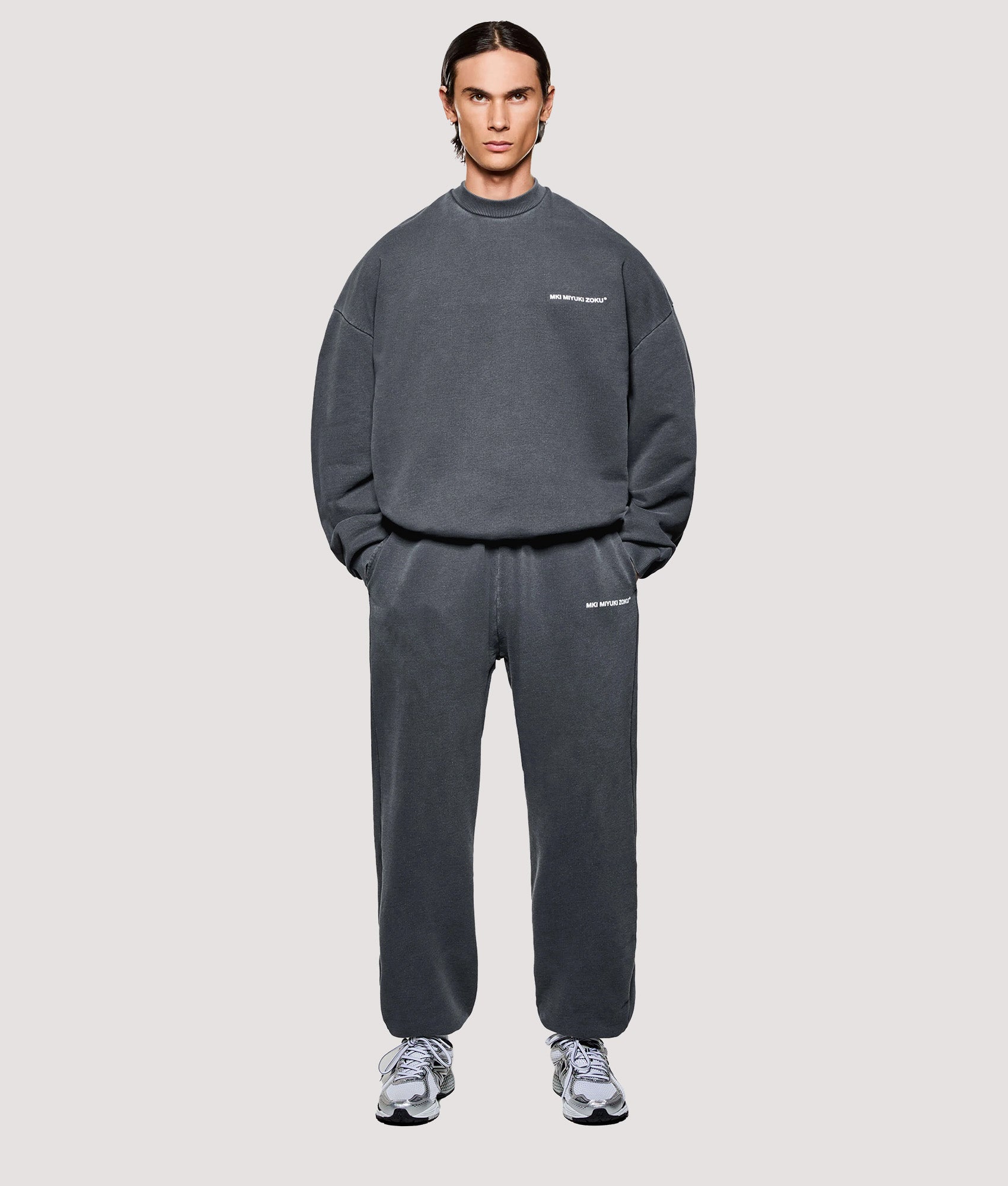 MKI MIYUKI ZOKU Box Fit Uniform Crewneck Sweatshirt in Pigment Black at EQVVS Menswear. Model full front shot.