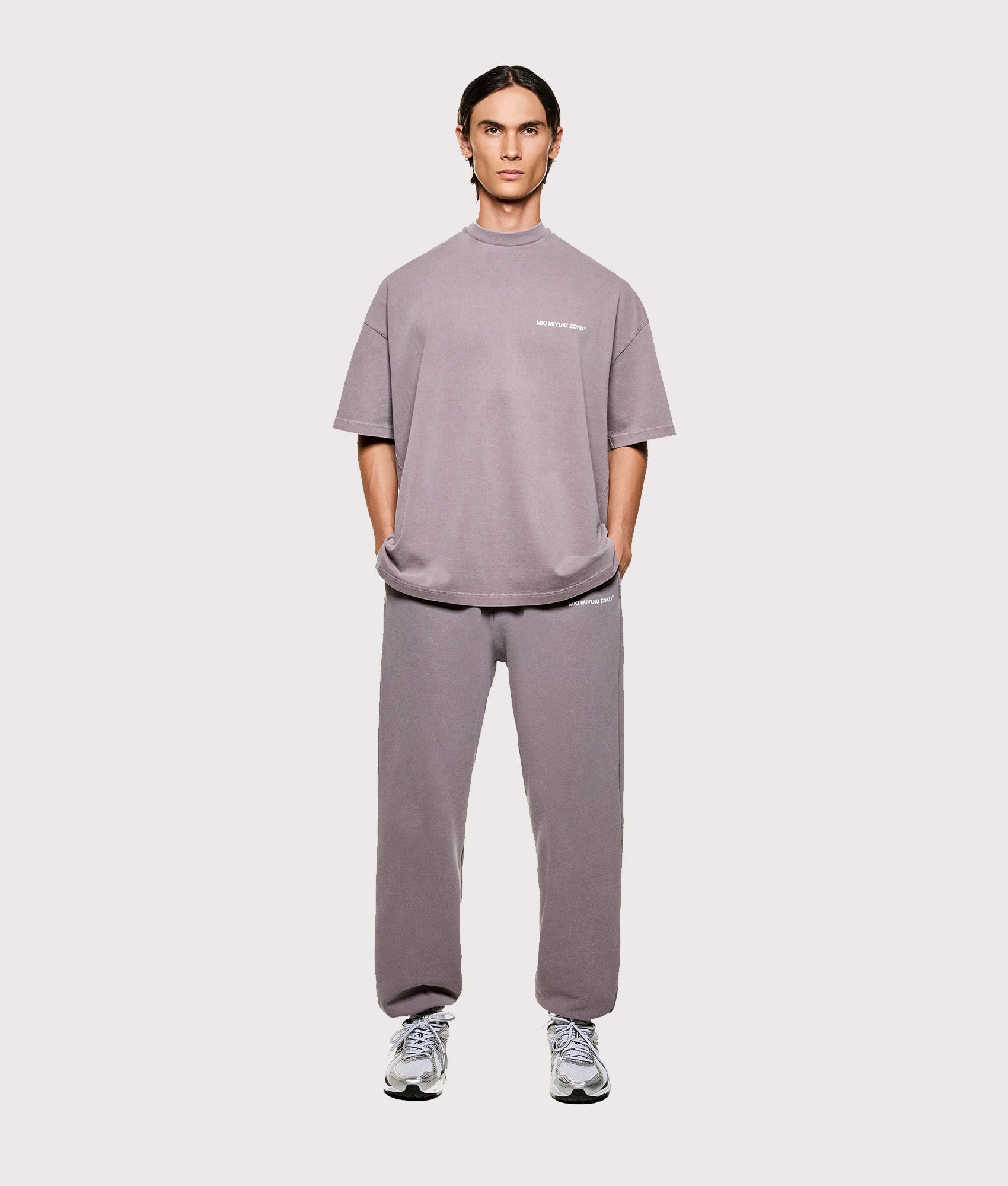 MKI MIYUKI ZOKU Oversized Uniform T-Shirt in Pigment Raisin at EQVVS Menswear. Model full front 