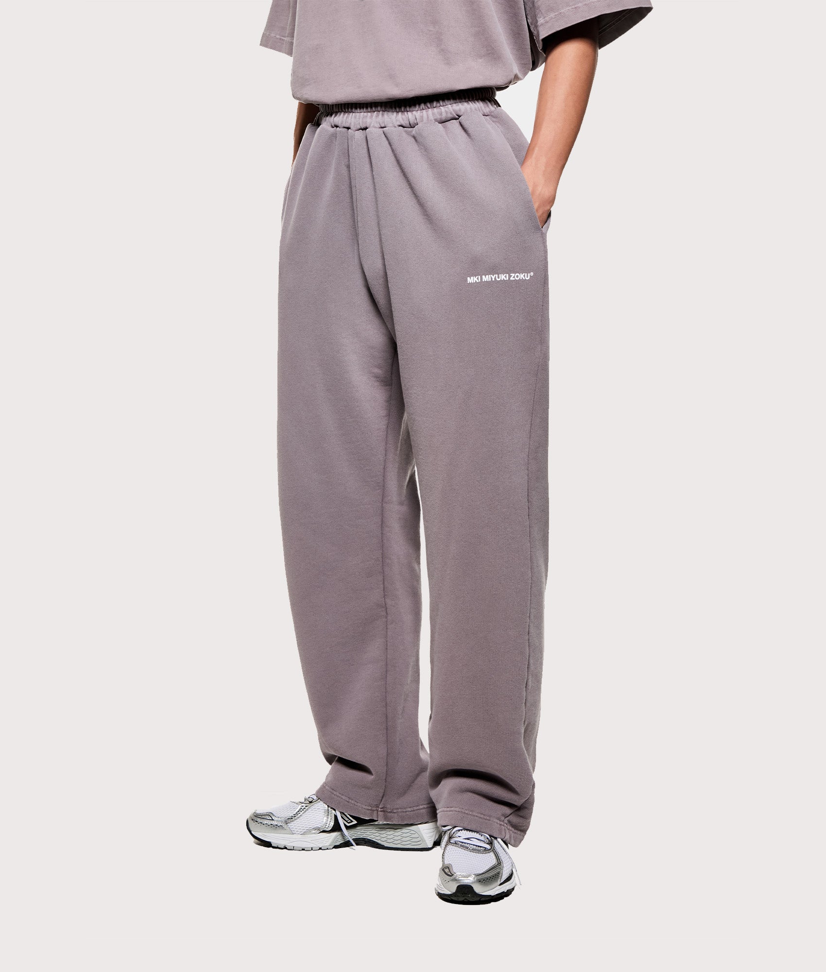 MKI MIYUKI ZOKU Uniform Wide Leg Joggers in Pigment Raisin. Angled front shot.
