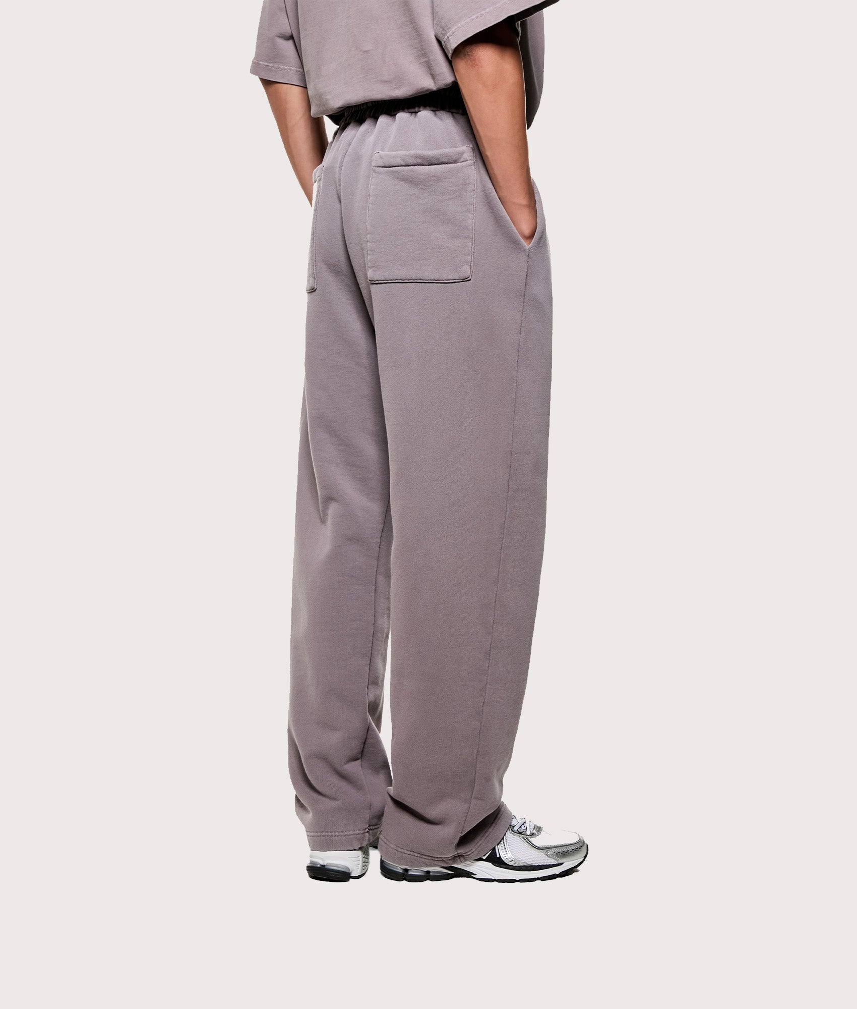 MKI MIYUKI ZOKU Uniform Wide Leg Joggers in Pigment Raisin. Angled back shot.