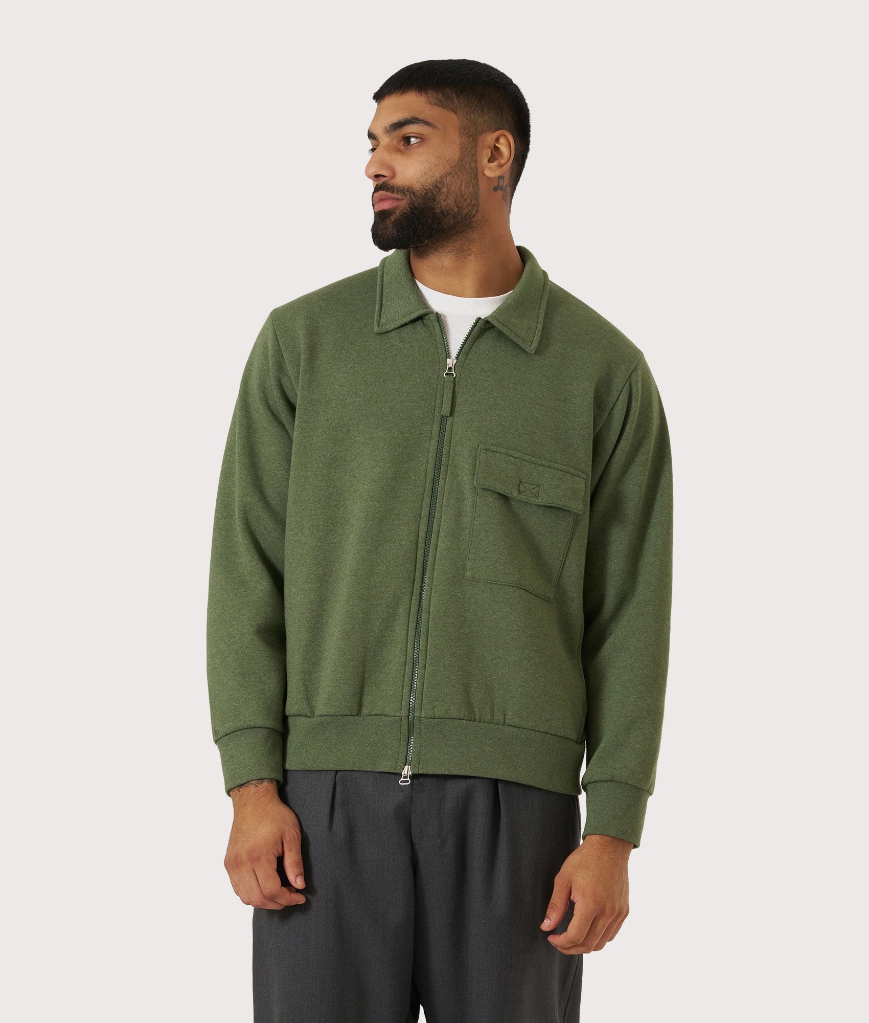 Universal Works Relaxed Fit Tyler Jacket in Green at EQVVS Menswear. Model front shot.