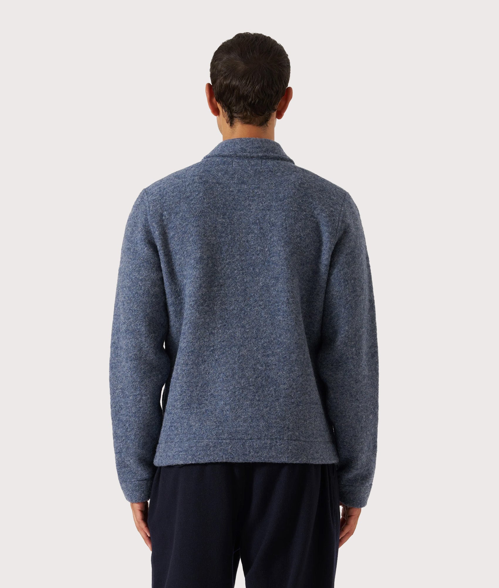 Universal Works Uniform Jacket in Slate Blue at EQVVS Menswear. Model back shot.