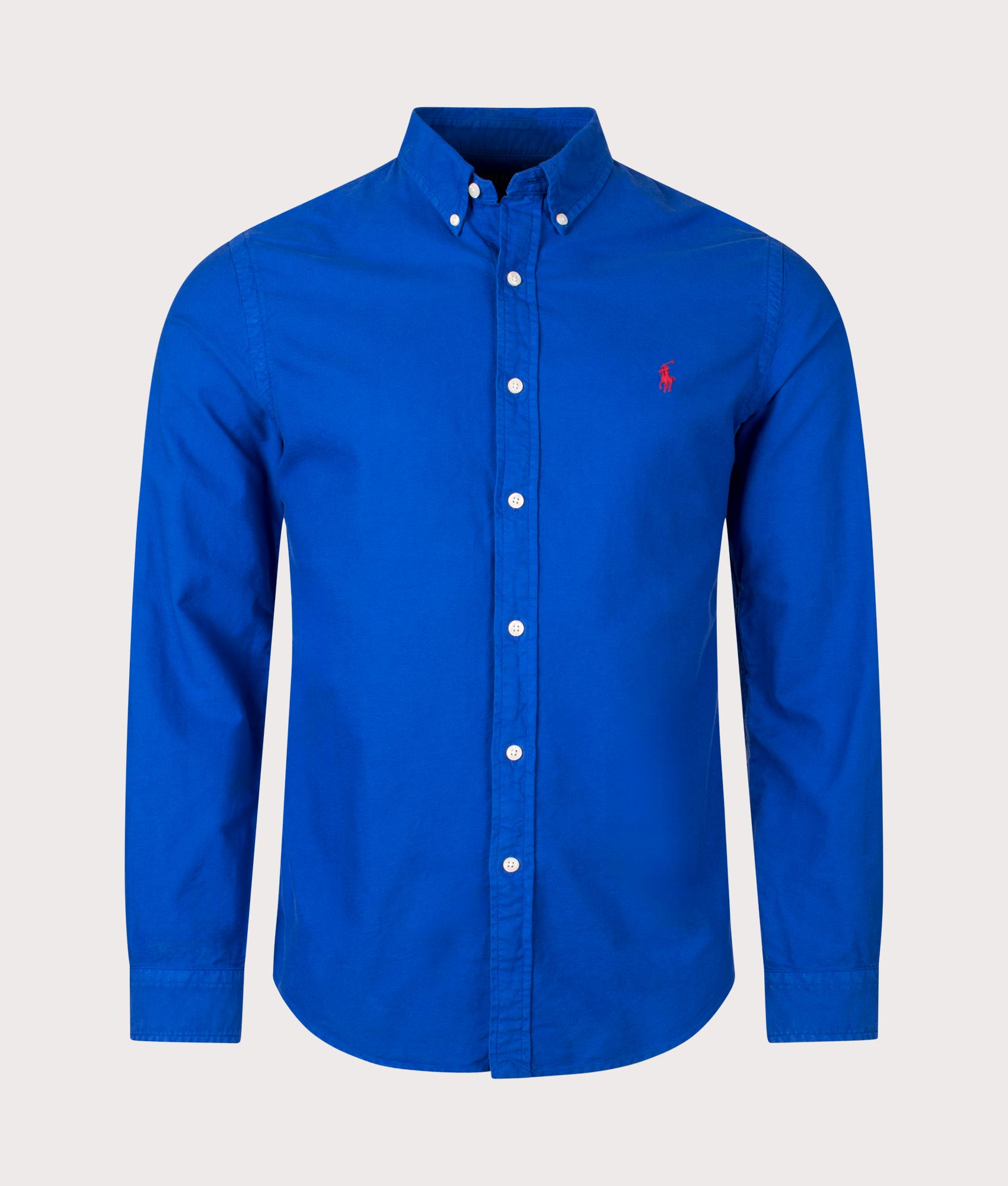 Slim Fit Garment-Dyed Oxford Shirt in New Sapphire by Polo Ralph Lauren. EQVVS Front Angle Shot.