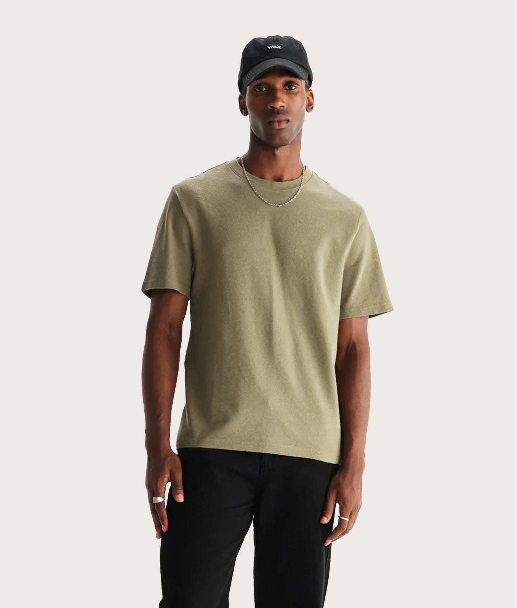 Wax London Dean Short Sleeve T-Shirt in Green at EQVVS Menswear. Model front shot.