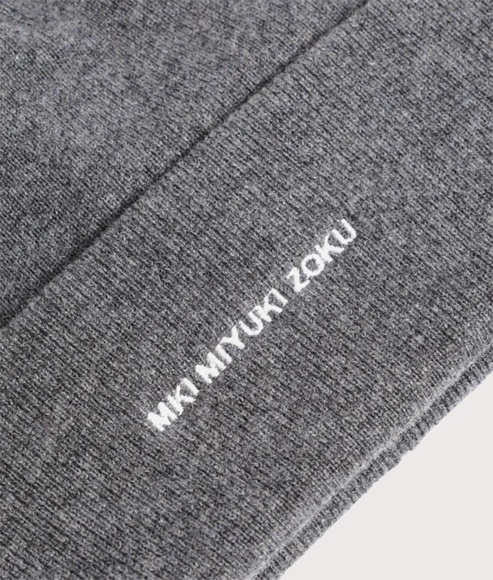MKI Embroidered Merino Beanie Charcoal. at EQVVS Menswear. Detail shot.