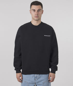 MKI MIYUKI ZOKU Oversized Uniform Crewneck Sweatshirt in Black at EQVVS Menswear. Model video.