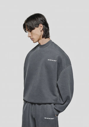 MKI Miyuki Zoku oversized Uniform Crew Sweatshirt in Pigment Black at EQVVS Menswear. Model video. 