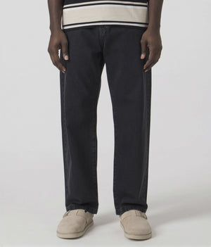 Carhartt WIP Relaxed Fit Landon Jeans in Black Stone Washed at EQVVS Menswear. Model video.
