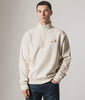 Carhartt WIP Relaxed Fit Quarter Zip American Script Sweatshirt in Moonbeam White at EQVVS Menswear. Model Video.