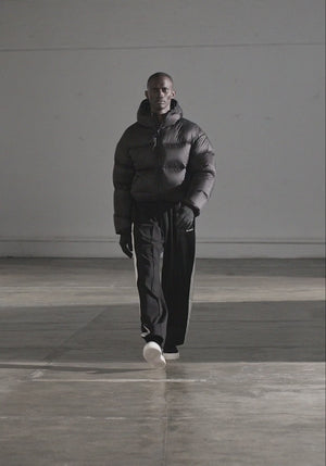 MKI MIYUKI ZOKU Translucent Bubble Jacket in Black at EQVVS Menswear. Side Model Shot. Catwalk Video 