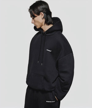 MKI MIYUKI ZOKU Oversized Uniform Hoodie in black at EQVVS Menswear. Model video. 