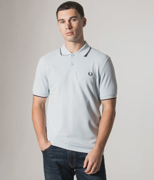 Fred Perry Twin Tipped Polo Shirt in Light Ice/Silky Peach/Tennis Blue at EQVVS Menswear. Model video.