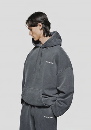 MKI Miyuki Zoku Oversized Uniform Hoodie in Pigment Black at EQVVS Menswear. Model video.