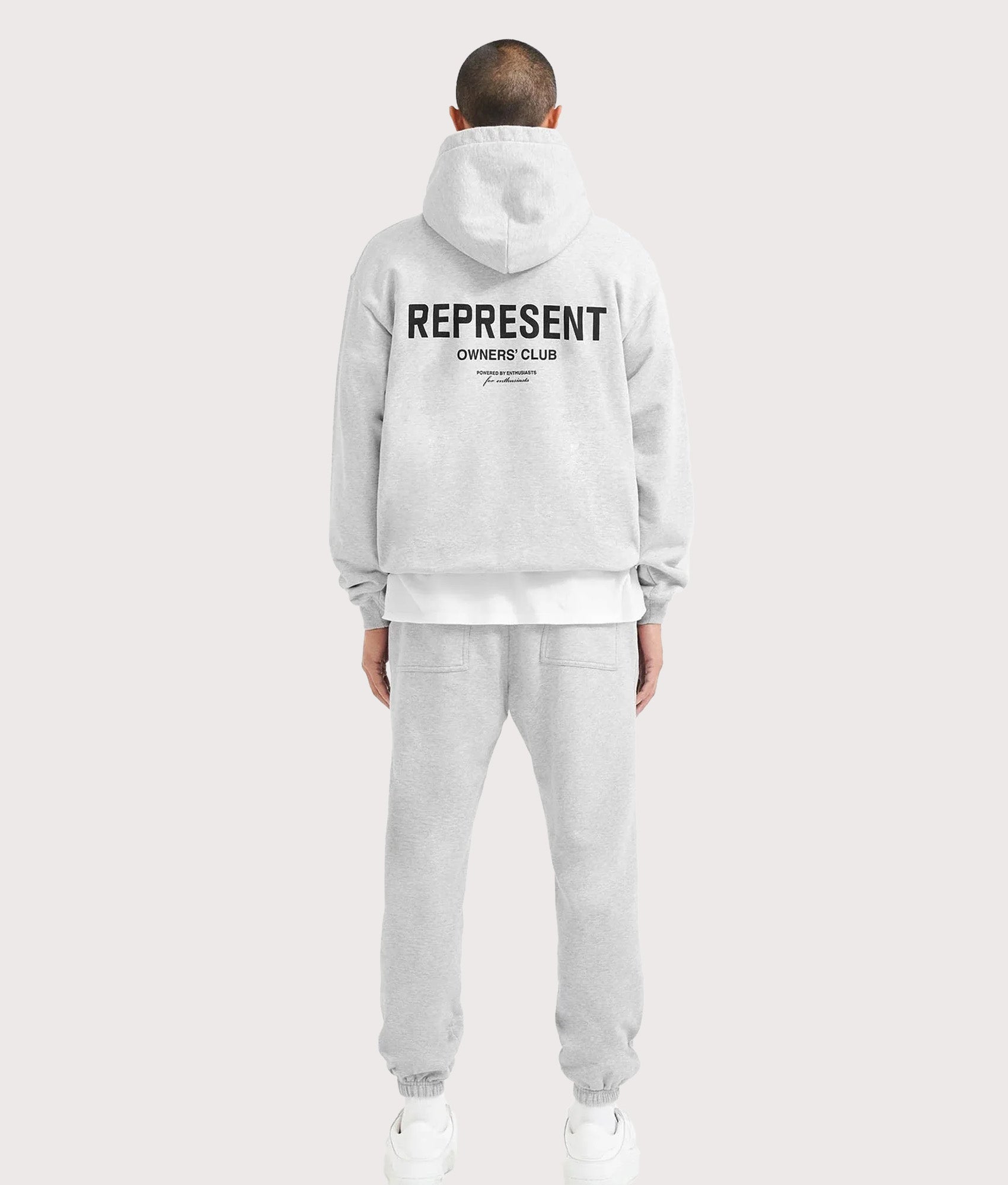 REPRESENT Oversized Fit Represent Owners Club Hoodie in Ash Grey at EQVVS Menswear. Model back shot.