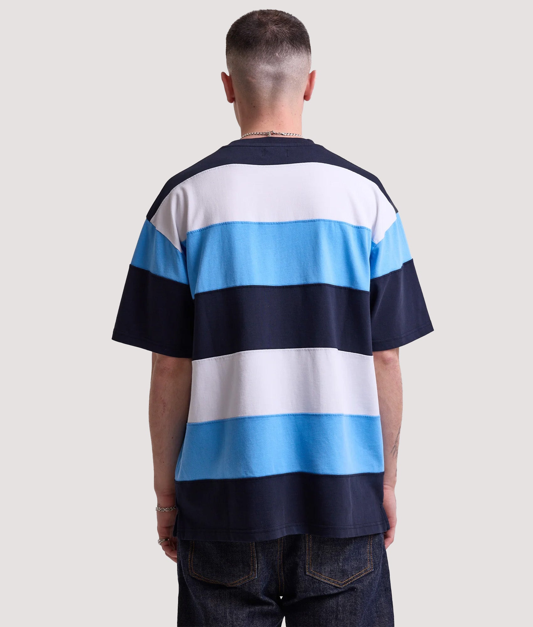 Rockport Relaxed Fit Dyer Stripe T-Shirt in Navy, white and blue stripe at EQVVS Menswear. Model back shot.
