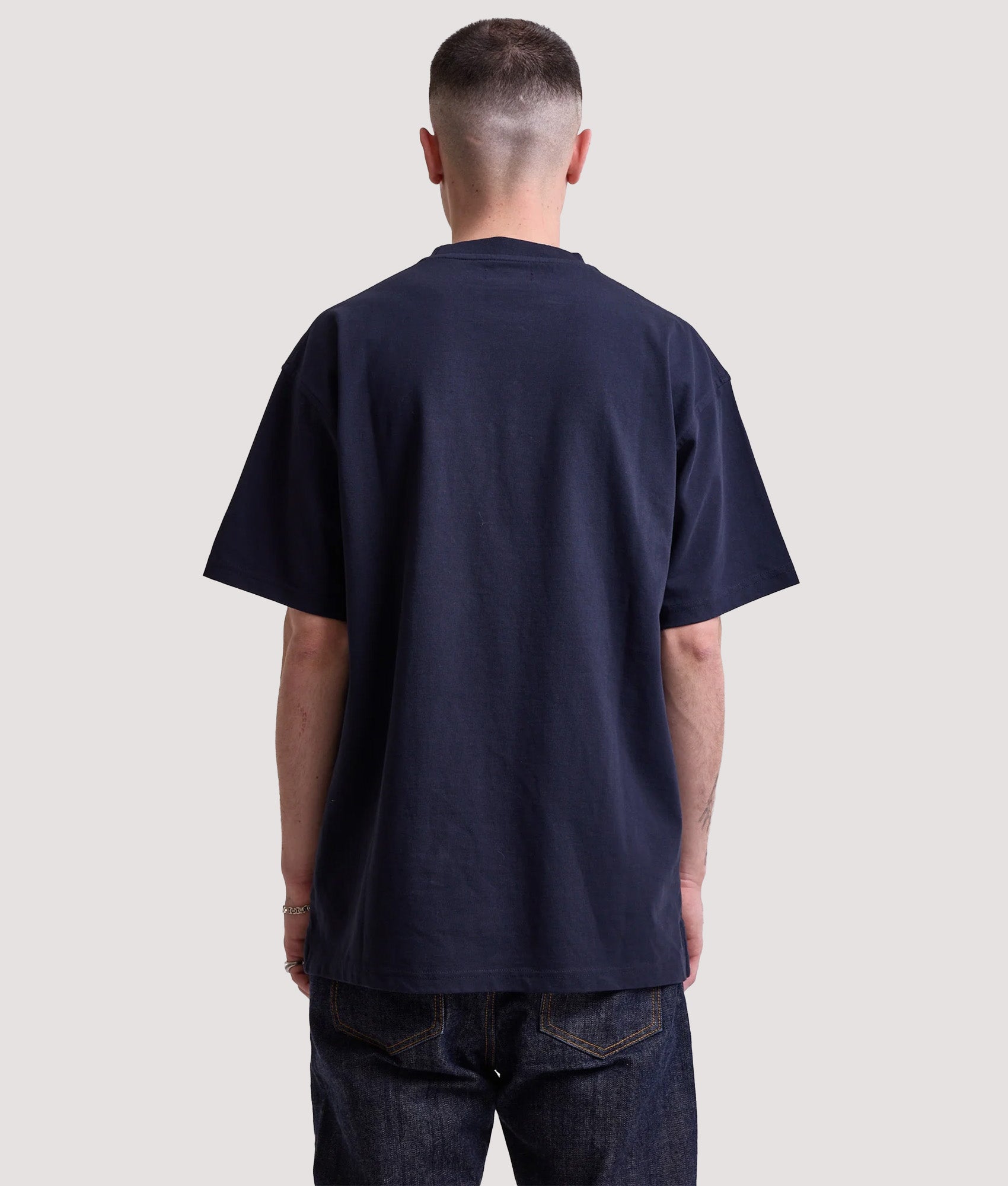 Rockport Relaxed Fit Hampshire Logo T-Shirt in Navy at EQVVS Menswear. Model back shot.