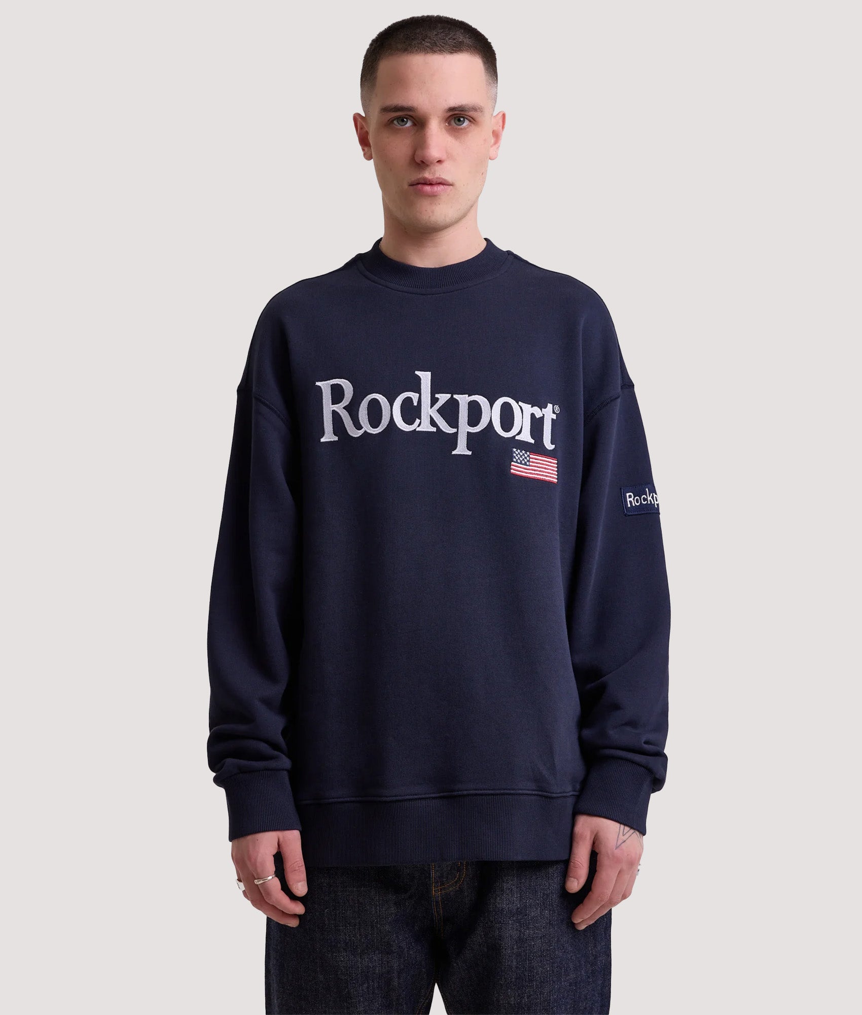 Rockport New England Front Logo Sweatshirt in Navy at EQVVS Menswear. Model front shot.