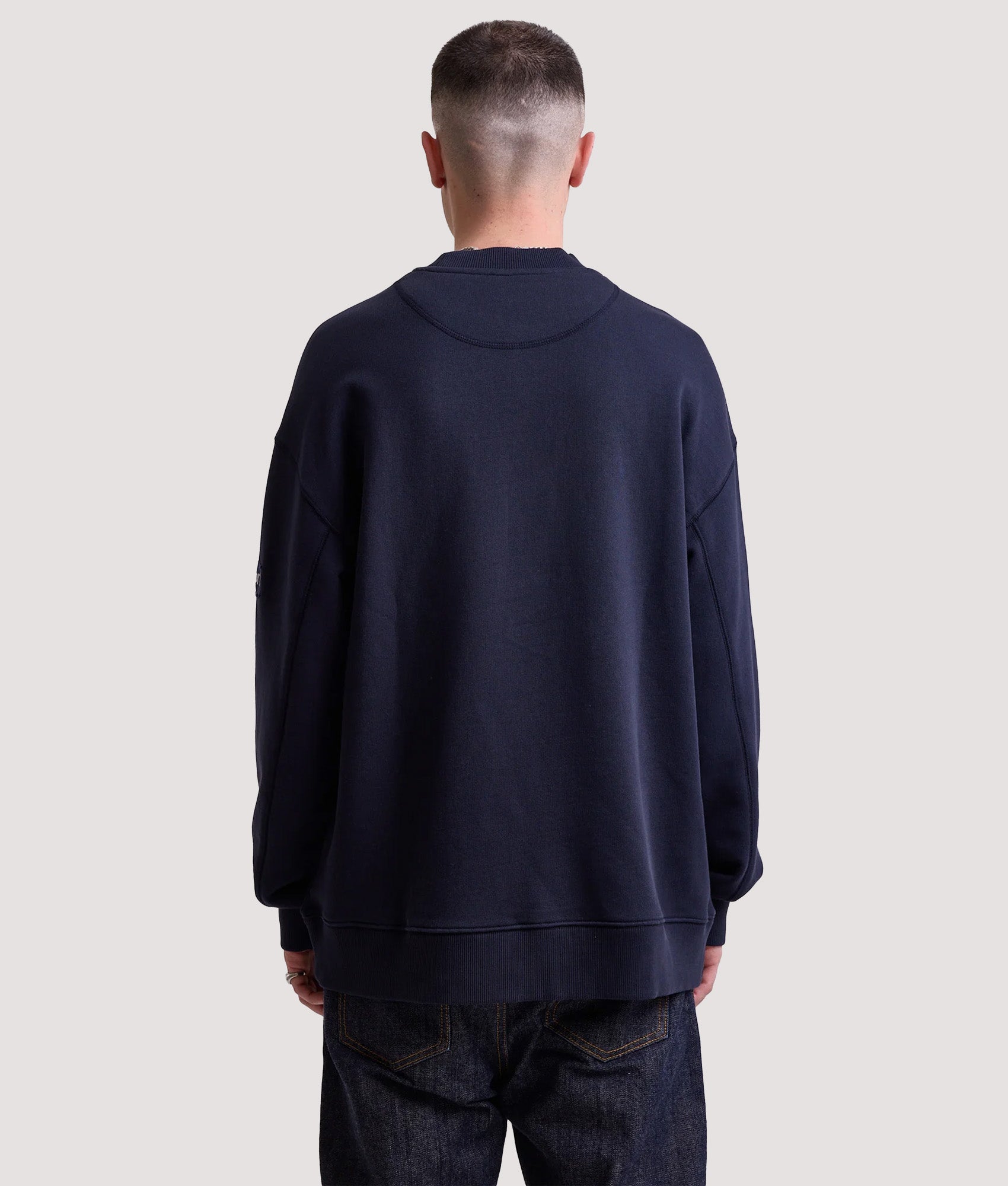 Rockport New England Front Logo Sweatshirt in Navy at EQVVS Menswear. Model back shot.