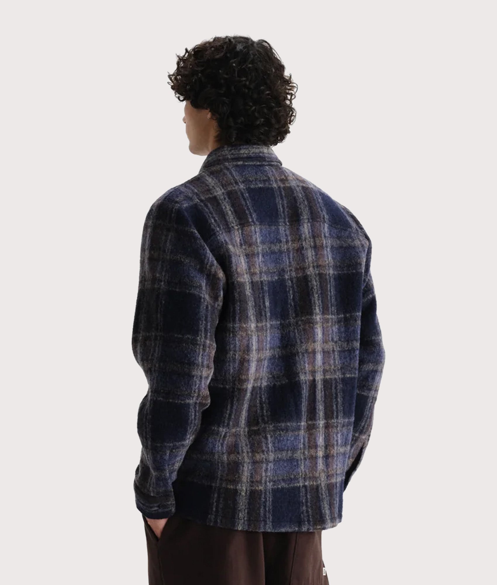 Wax London Whiting Overshirt in Navy at EQVVS Menswear. Angled model back shot.