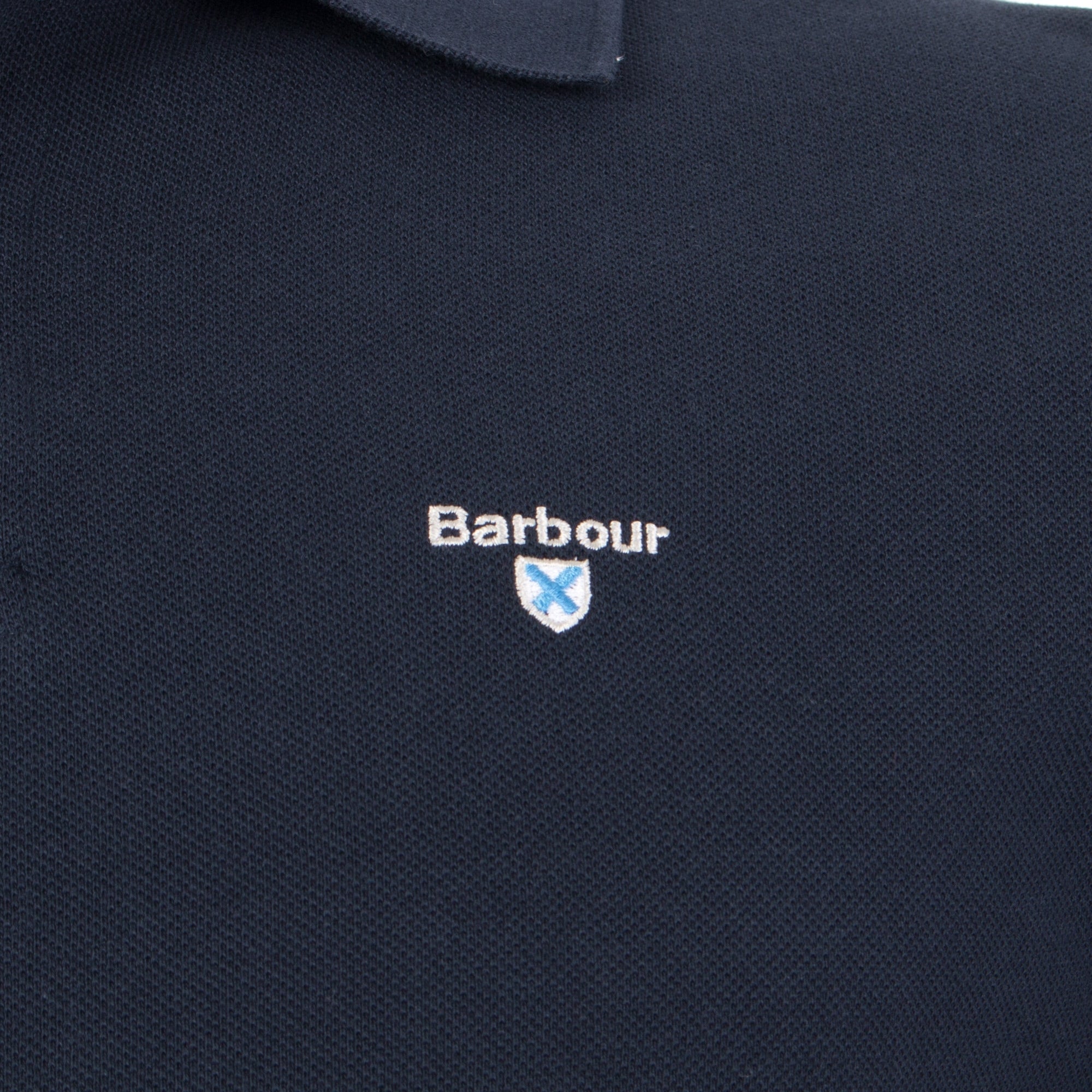 Barbour Lifestyle Tartan Placket Piqué Polo Shirt in New Navy at EQVVS Menswear. Detail shot.