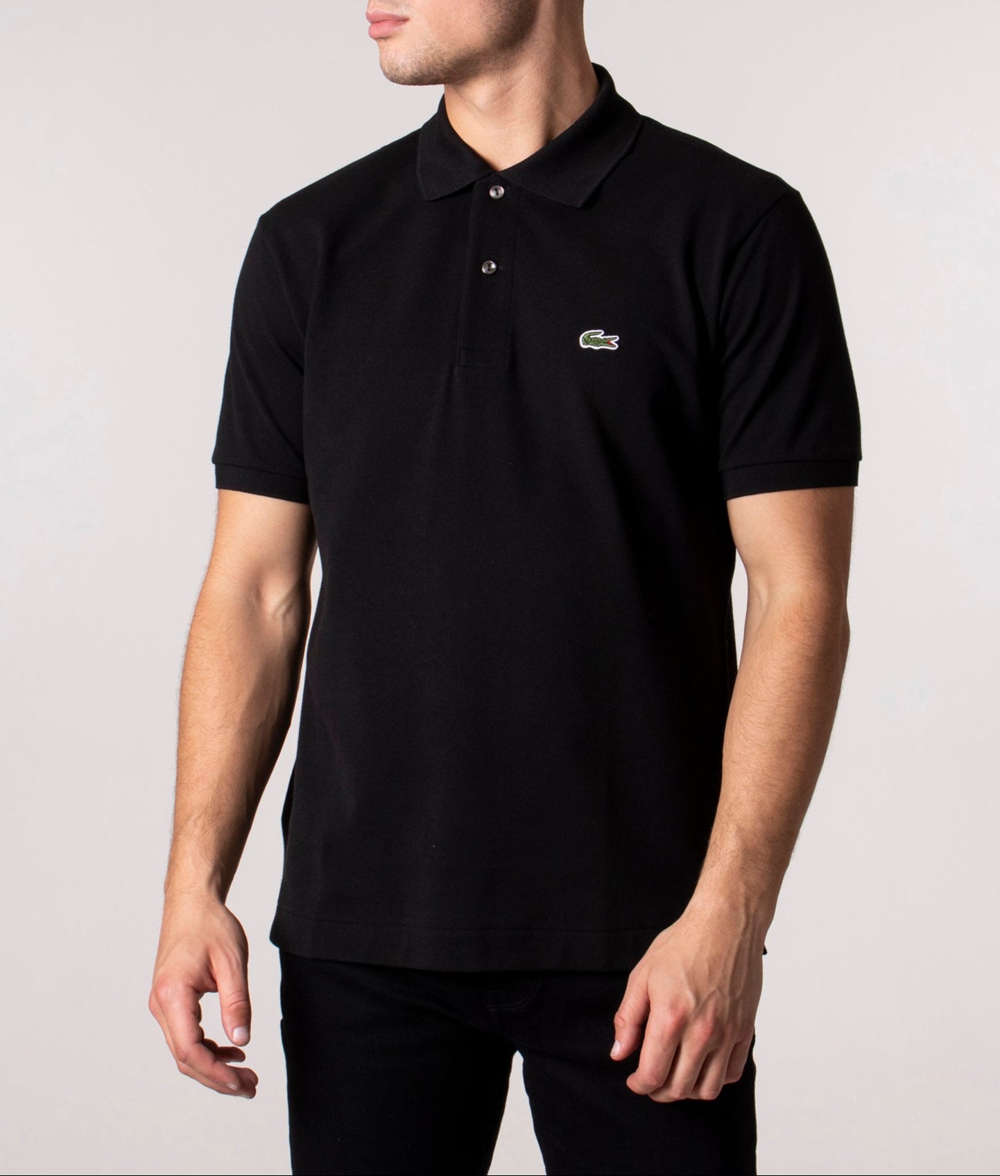 Lacoste Classic Fit L1212 Croc Logo Polo Shirt in Black at EQVVS Menswear. Angled front shot.
